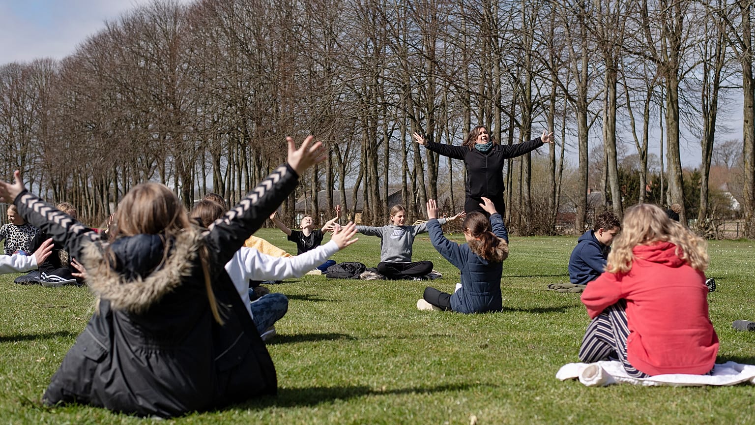 An outdoor music lesson at the Korshoejskolen in Randers, Denmark, Wednesday, April 15, 2020, as the country begins to relax its strict coronavirus lockdown measures.