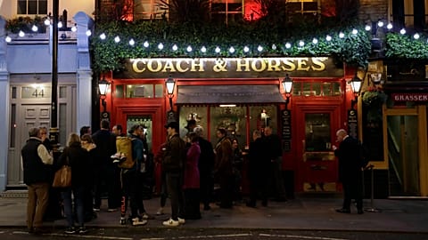 Londonders enjoy a drink at a crowded pub on St Patrick's Day amid a worsening coronavirus crisis