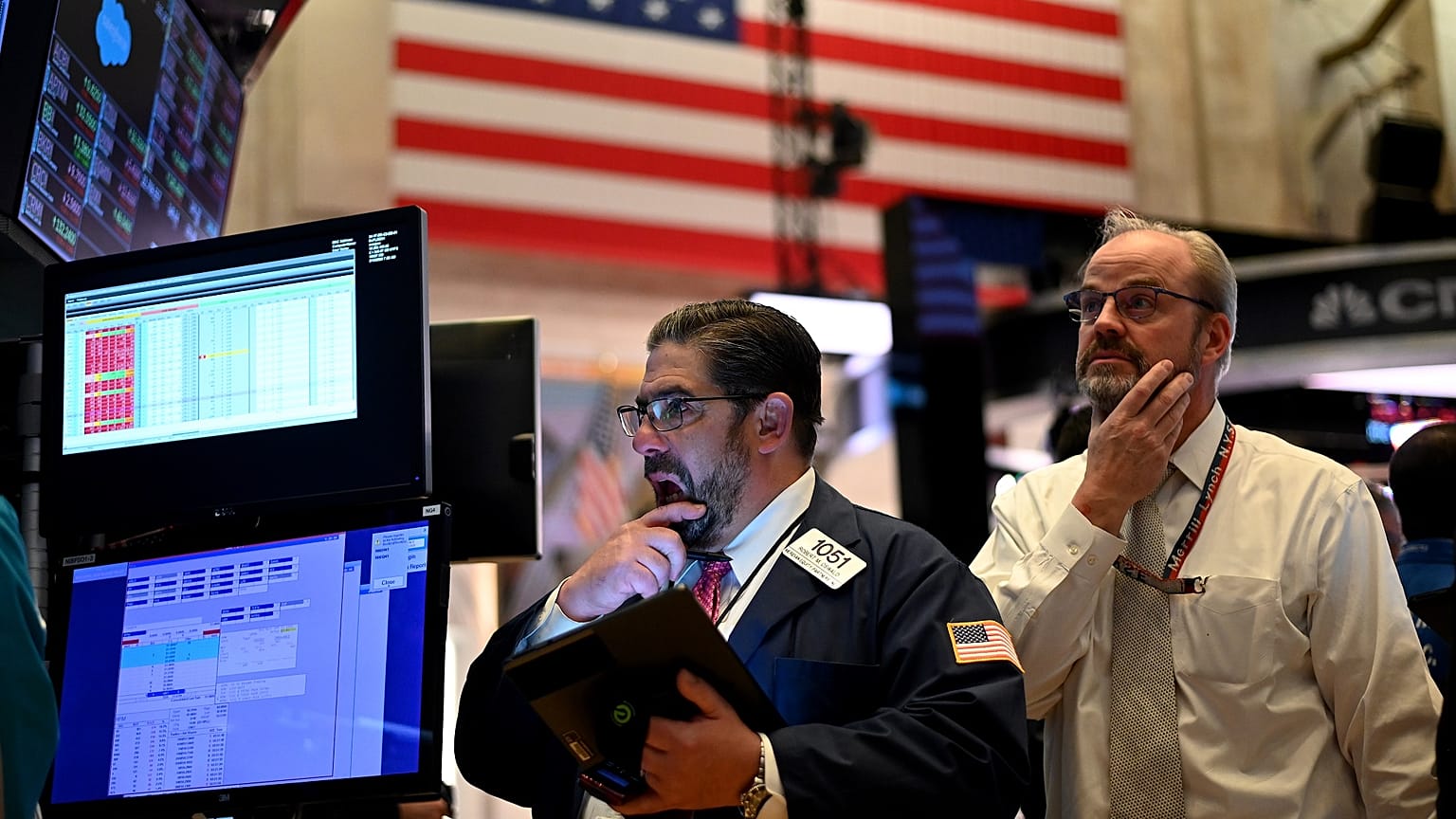 Traders work during the closing bell at the New York Stock Exchange (NYSE) at Wall Street in New York City on March 18, 2020.
