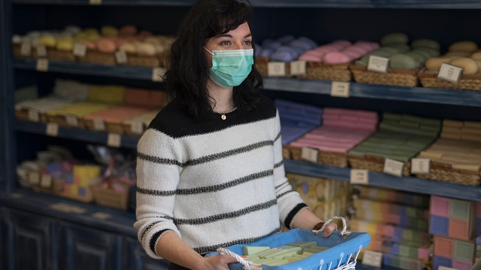 Melanie Dinot, a retail worker at the Savonnerie de la Licorne poses for a portrait hours before nationwide confinement measures were in effect in Marseille, France, March 17.