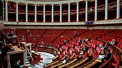 French members of Parliament take part in a debate about the state of health emergency bill at the National Assembly on March 21, 2020, in Paris