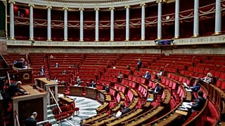 French members of Parliament take part in a debate about the state of health emergency bill at the National Assembly on March 21, 2020, in Paris
