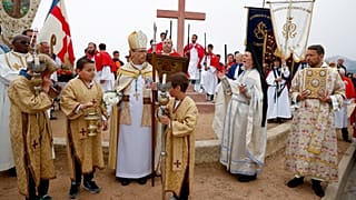 Orthodox priest of the Saint Spyridion church in Cargese attend a religious ceremony, on April 22, 2019