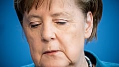 German Chancellor Angela Merkel  on the spread of the new coronavirus COVID-19 at the Chancellery, in Berlin on March 22, 2020. (Photo by Michael Kappeler / AFP)