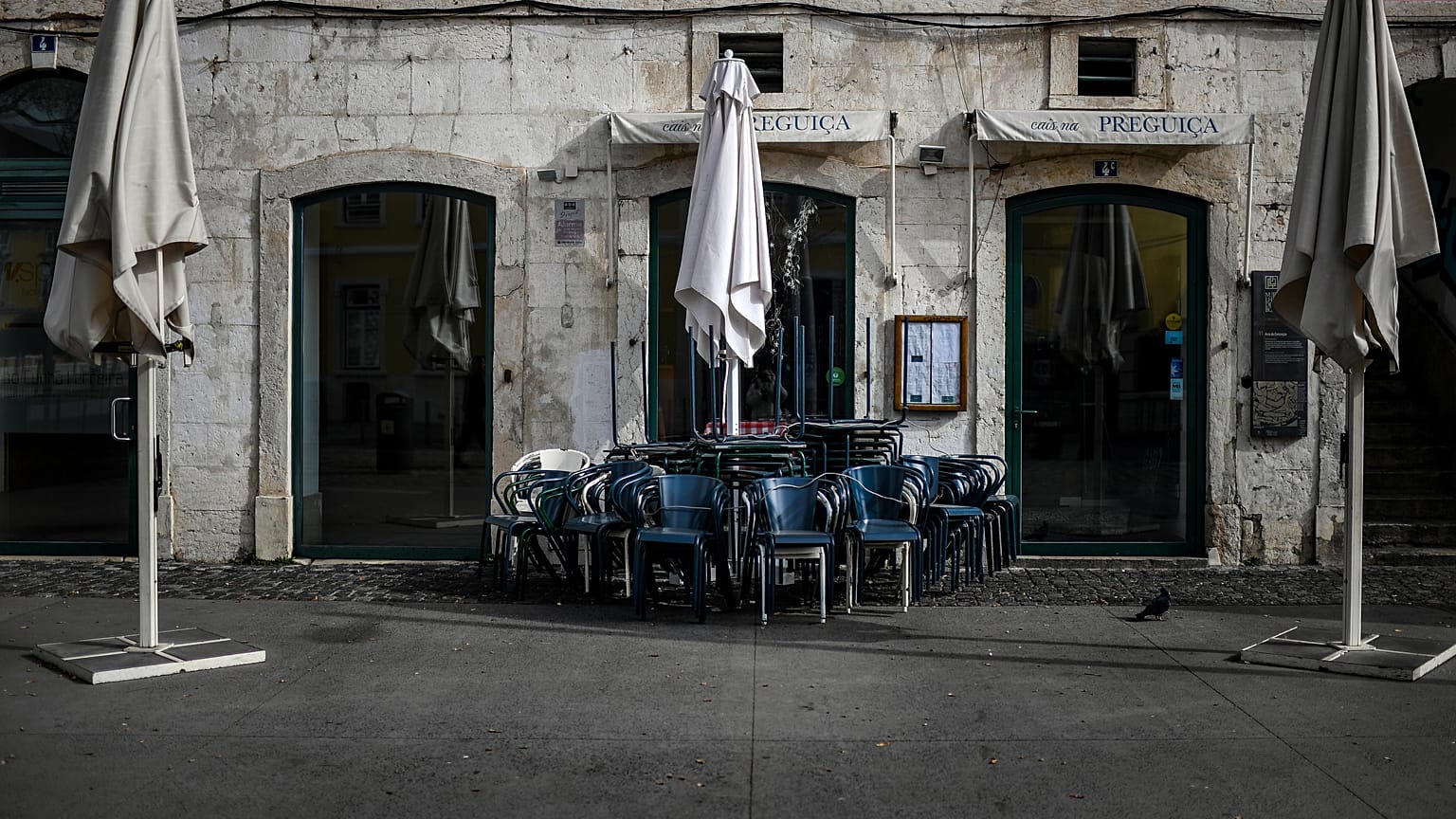 Closed restaurants are pictured in downtown Lisbon