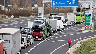 Drivers wait in the traffic jams on the A4 motorway towards Hungary. (Photo by ALEX HALADA / AFP)