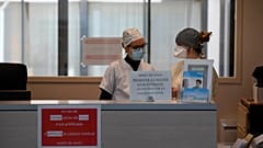 Nurses wearing protective face masks are pictured 