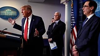 Donald Trump speaks about the coronavirus in the James Brady Briefing Room, Wednesday, March 25, 2020, in Washington as Mike Pence and Treasury Secretary Steven Mnuchin listen