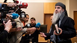Mullah Krekar faces the media in a District Court in Oslo, Norway, Wednesday July 17, 2019.