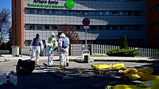 Members of the Military Emergencies Unit (UME) prepare to carry out a general disinfection at the Arturo Soria residence for the elderly in Madrid on March 28, 2020