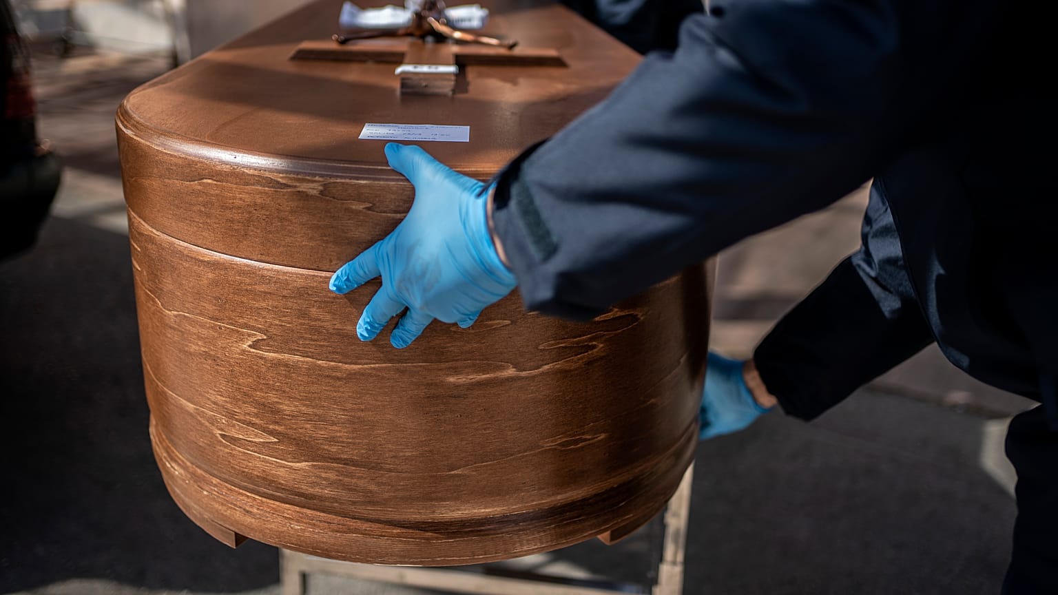 The coffin containing remains of a victim of the COVID-19 is taken for cremation at the Almudena cemetery in Madrid, Spain, Saturday March 28, 2020.