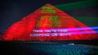 Messages of support for health workers are displayed on a pyramid in Egypt