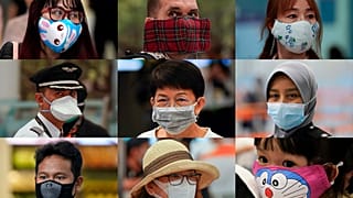 APTOPIX China Outbreak Masks