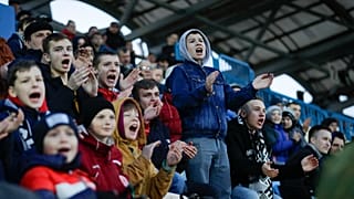In this photo taken on Friday, March 27, 2020, young fans react during the Belarus Championship soccer match between Torpedo-BelAZ Zhodino and Belshina Bobruisk.