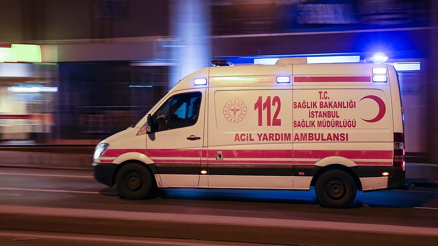 An ambulance is driven through the deserted streets of central Istanbul, late Friday, April 3, 2020