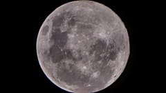 Thin clouds cover the 'Supermoon', also know as a pink moon. The view from Jakarta, Indonesia