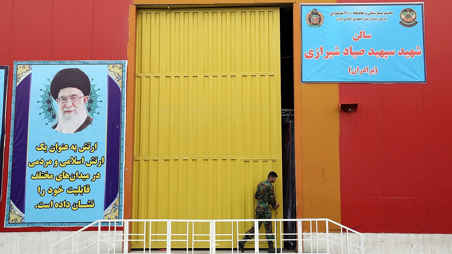A member of the Iranian Army works at a temporary hospital in Tehran, Iran, Thursday, March 26, 2020