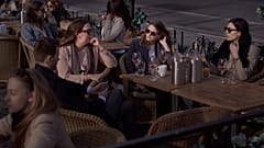 People chat and drink in Stockholm, Sweden, Wednesday, April 8, 2020. 