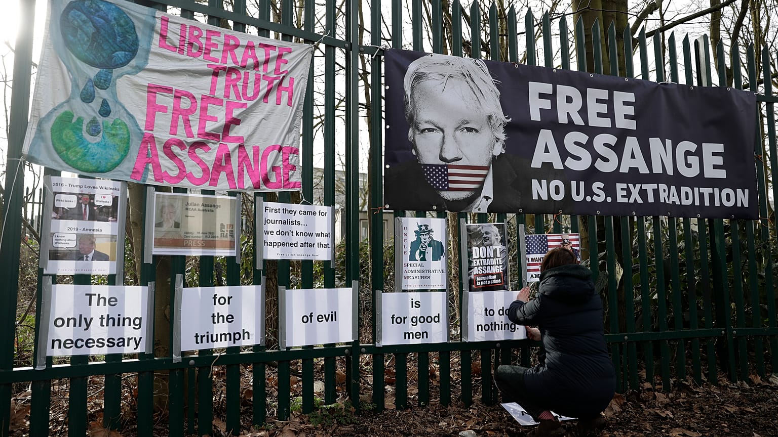 Julian Assange's partner revealed Saturday that she had two children with him while he lived inside the Ecuadorian Embassy in London.