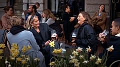 In this Wednesday, April 8, 2020 file photo people chat and drink outside a bar in Stockholm, Sweden