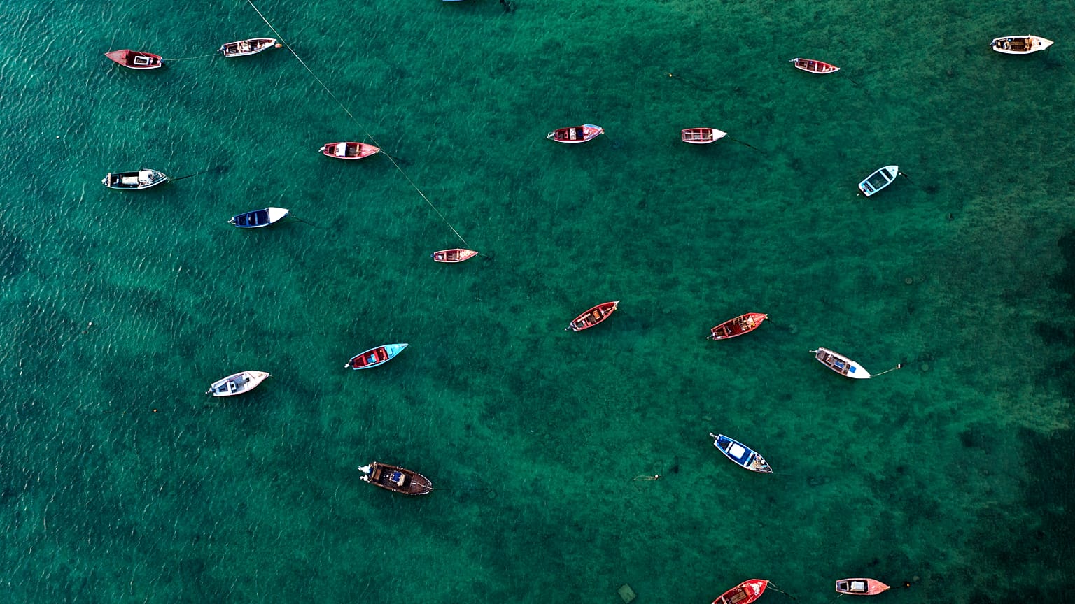 An aerial view shows fisher boats at the harbour in Sal Rei at Boa Vista island, Cape Verde, on January 06, 2020. (Photo by INA FASSBENDER / AFP)