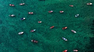 An aerial view shows fisher boats at the harbour in Sal Rei at Boa Vista island, Cape Verde, on January 06, 2020. (Photo by INA FASSBENDER / AFP)