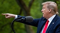 President Donald Trump points to a question as he speaks about the coronavirus in the Rose Garden of the White House, Tuesday, April 14, 2020, in Washington.