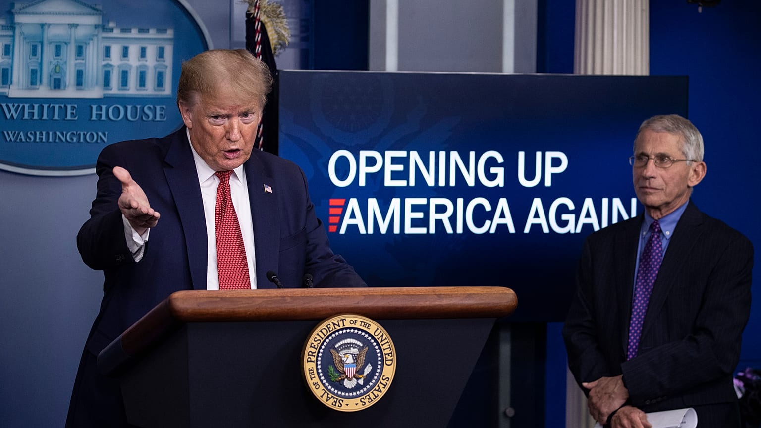 President Donald Trump with Dr Anthony Fauci, director of the National Institute of Allergy and Infectious Diseases, at the White House, Washington DC, April 16, 2020.