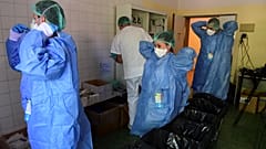 Members of the medical staff at the COVID-19 unit of the Policlinico Sant'Orsola-Malpighi hospital in Bologna on April 15, 2020