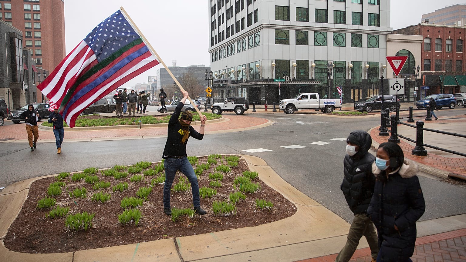 A man approaches the Capitol Building during Operation Gridlock, a protest against aspects of Gov. Whitmer's lockdown order, in Lansing, Michigan, Wednesday, April 15, 2020.