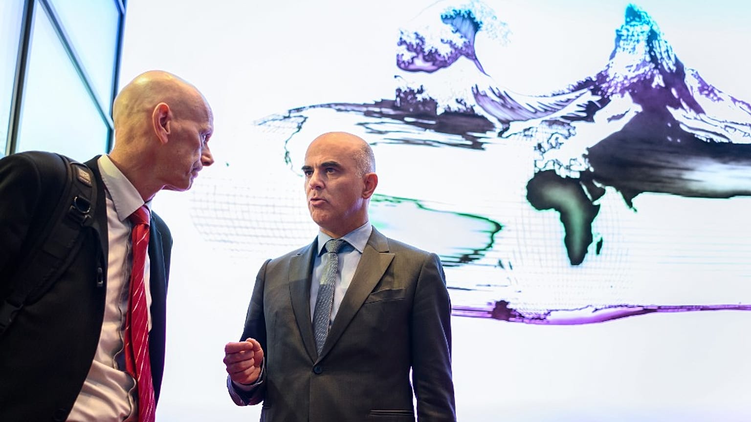 Daniel Koch of the Swiss Federal office of public health listens to Swiss Interior Minister Alain Berset 