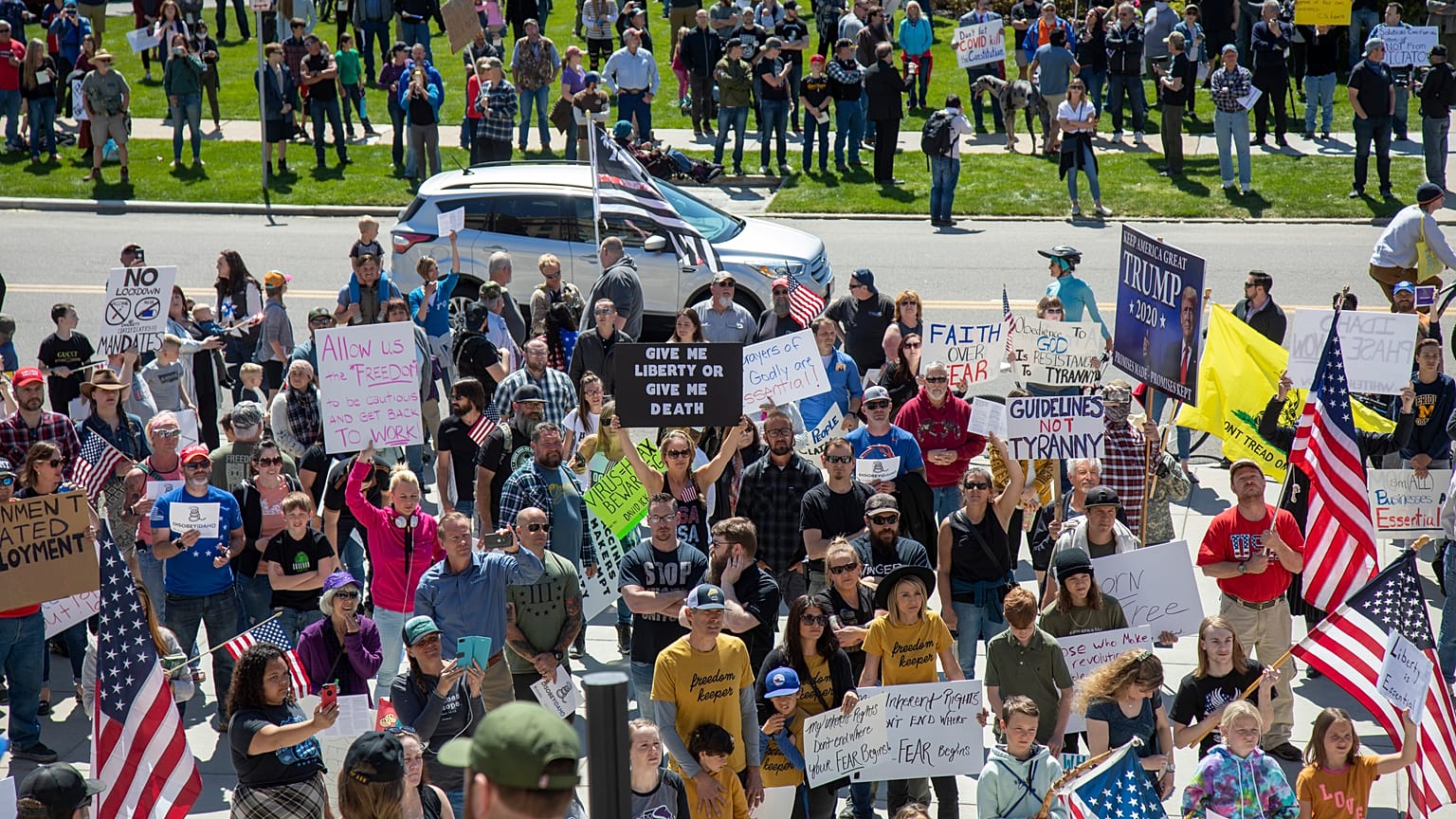 Several hundred people attend a "Stand for Freedom" rally against - and in violation of - a stay-at-home locidown order in Boise, Idaho, Friday, April 17, 2020. 