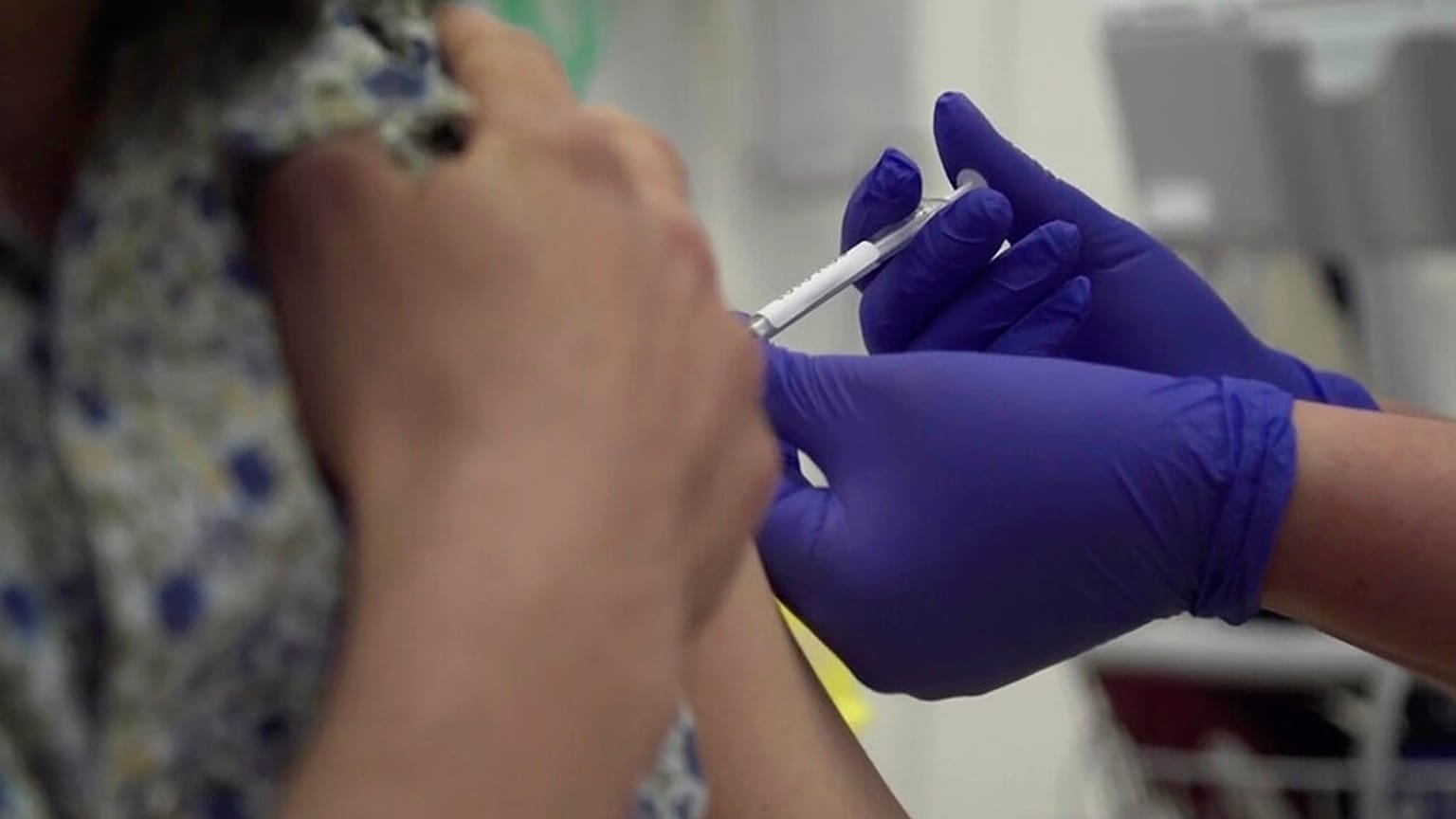 Screen grab taken from video issued by Britain's Oxford University, showing a person being injected as part of the first human trials in the UK to test a potential coronavirus