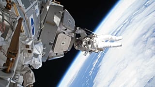Astronauts on a space walk.