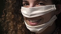 French Anissa Mekrabech, wearing the protective face mask she created for the deaf earing-impaired people