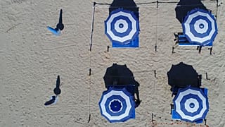Aerial photo handout of beach resort Bacino Grande in Porto Cesareo, Italy, showing a possible model of beach adopting social-distancing rules - FILE