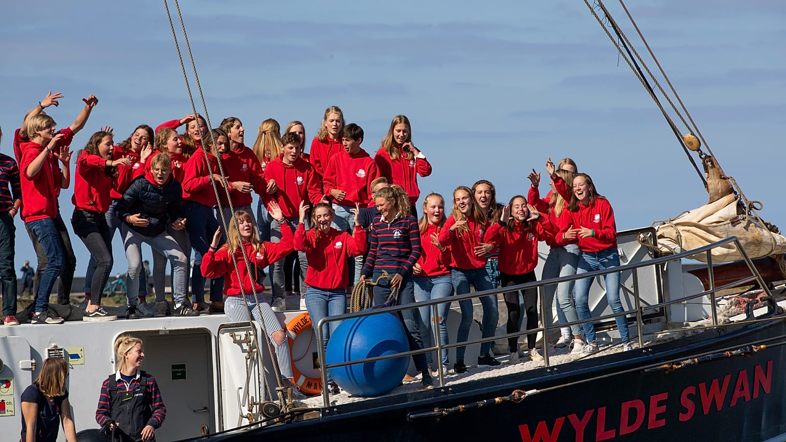 Dutch teens cheer after arriving home in Harlingen on April 26 following a trans-Atlantic forced on them by lockdown restrictions.