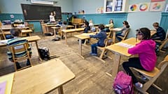 Third grade pupils at Nordstrand Steinerskole school in Oslo attend a lesson after the school reopened on April 27, 2020