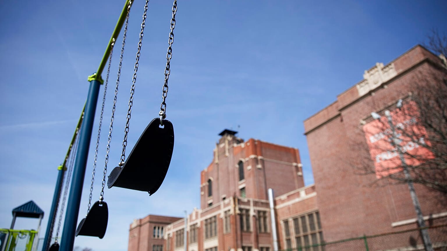 Swings sit empty on a playground outside Achievement First charter school Saturday, March 7, 2020, in Providence, Rhode Island, US