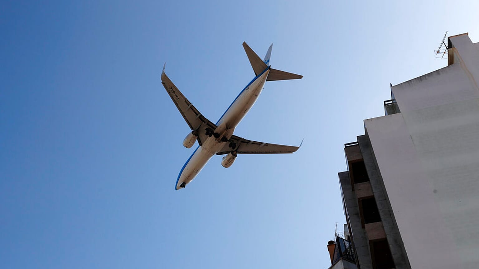 In this file photo dated Aug. 21, 2019, a KLM passenger plane approaches for landing at Lisbon airport. 