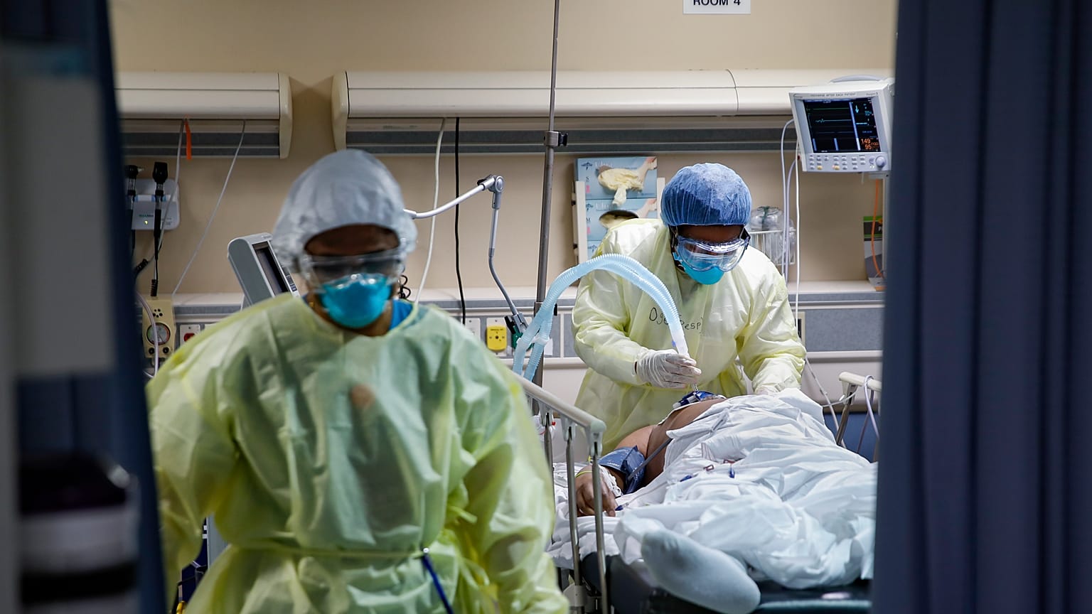 A respiratory specialist operates a ventilator for a patient with COVID-19, April 20, 2020, at St. Joseph's Hospital in Yonkers, N.Y.