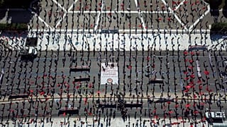 This photo provided by the communist party-affiliated PAME union shows social distancing practised during a May Day rally outside the Greek Parliament, Athens, May 1, 2020.