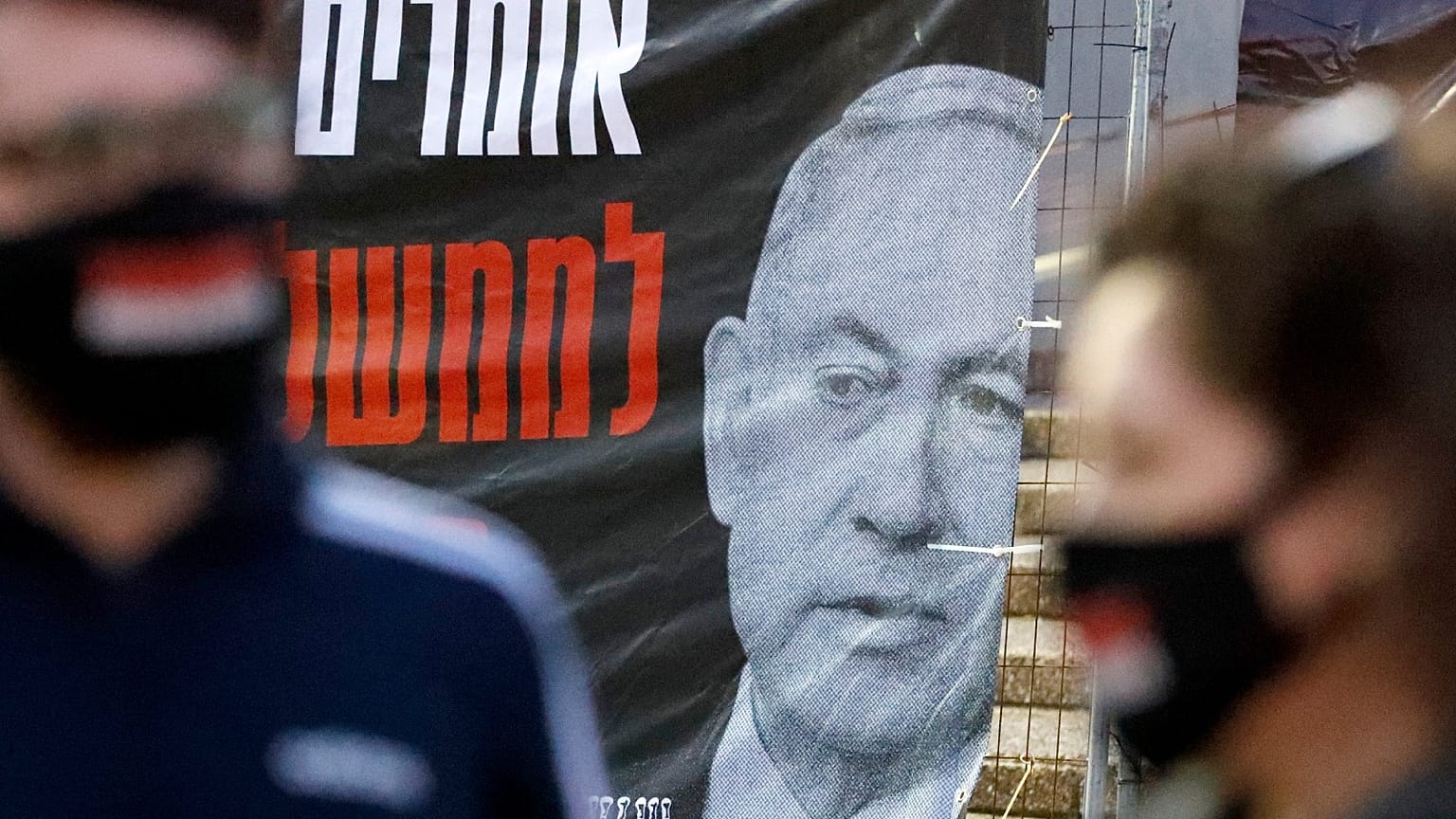Israelis wearing a protective masks against coronavirus take part in a demonstration in favour of the Supreme Court in Tel Aviv's Rabin Square on May 2, 2020