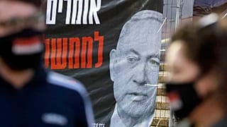 Israelis wearing a protective masks against coronavirus take part in a demonstration in favour of the Supreme Court in Tel Aviv's Rabin Square on May 2, 2020