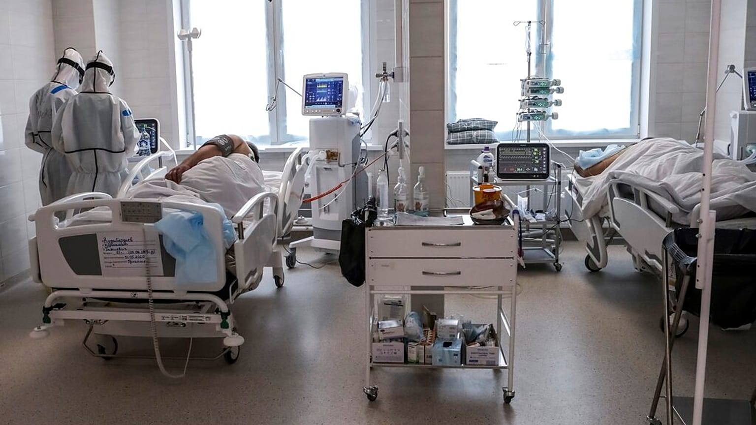 Doctors attend to a patient inside the intensive care unit for people infected with the new coronavirus, at a hospital in Moscow, Russia, May 2, 2020.