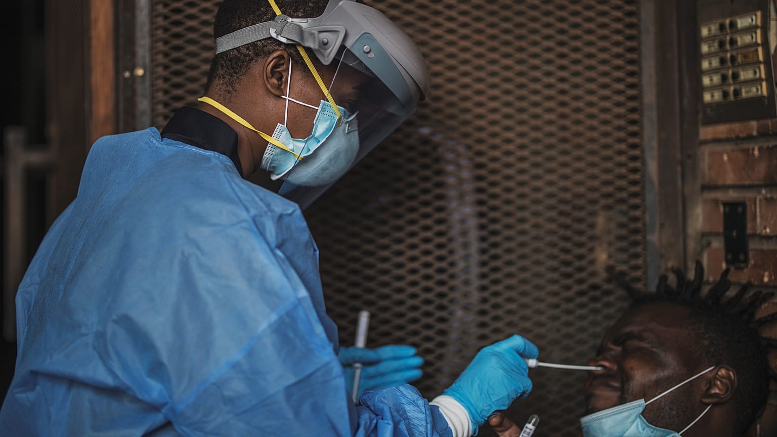 A Gauteng Health Department Official collects samples from a man 