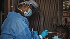 A Gauteng Health Department Official collects samples from a man 