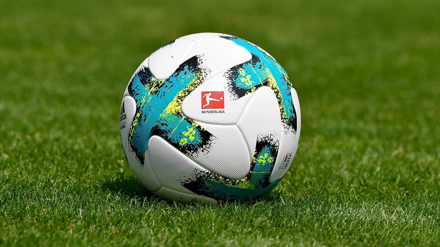 In this file photo taken on August 01, 2017 a ball with the logo of the German first division football league Bundesliga is seen on the pitch