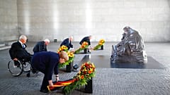 German Chancellor Angela Merkel and other officials lay wreaths at the Neue Wache Memorial in Berlin, Germany, May 8, 2020. 