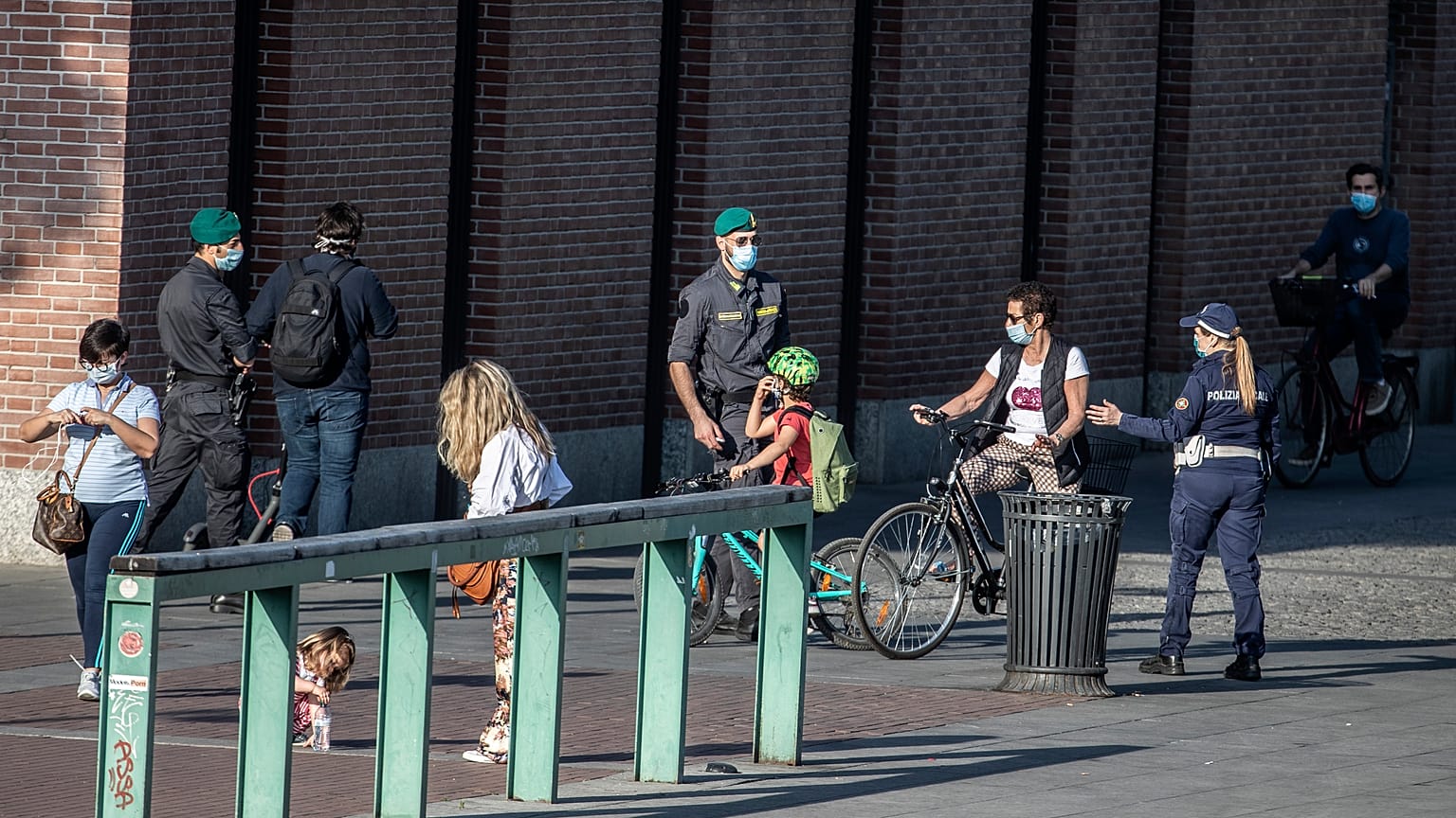 Extra police officers patrol Europe's streets and beaches as lockdown restrictions ease